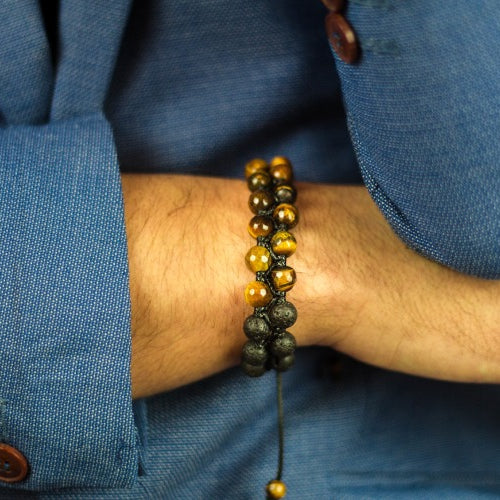 closeup shot man wearing beautiful bracelet made stones