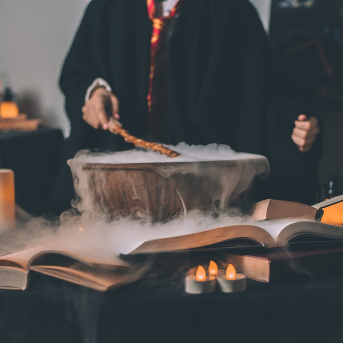 person holding wand on top of bowl