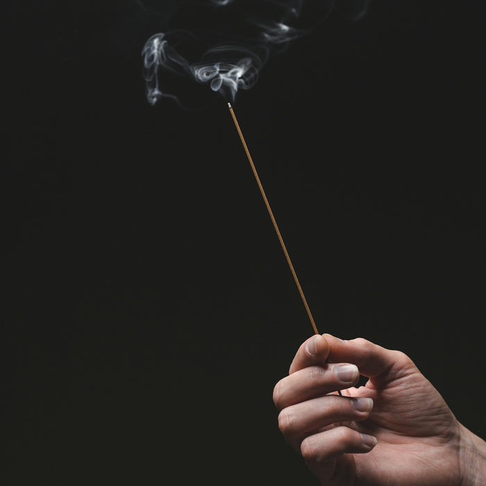 person holding a white smoke