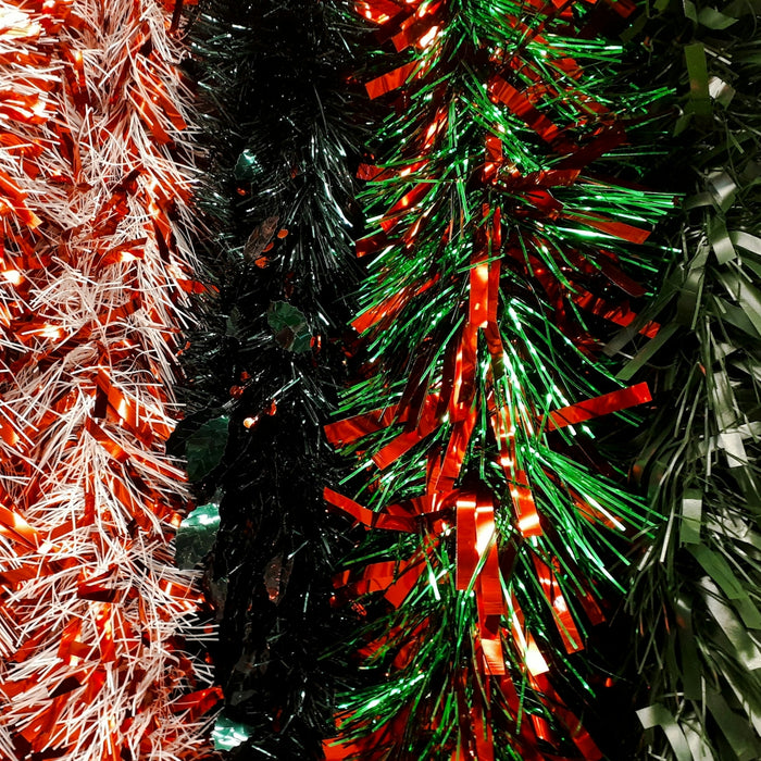 a couple of christmas trees that are next to each other