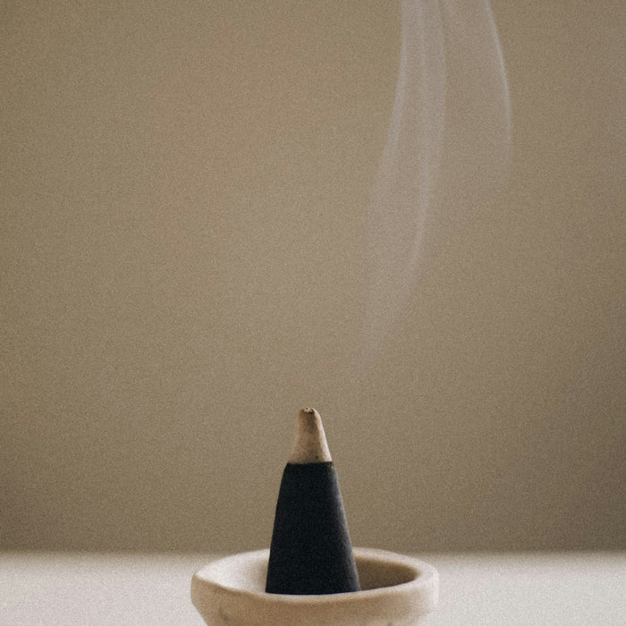 a smokestack sitting in a bowl on a table
