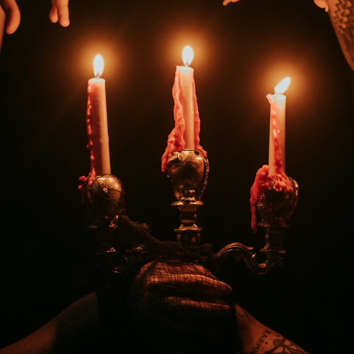 a group of people holding candles