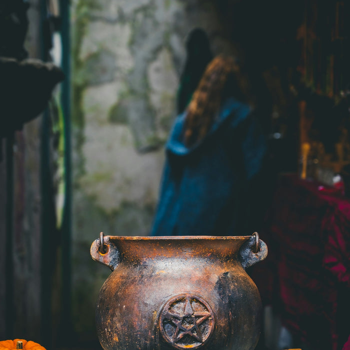a vase with a face painted on it