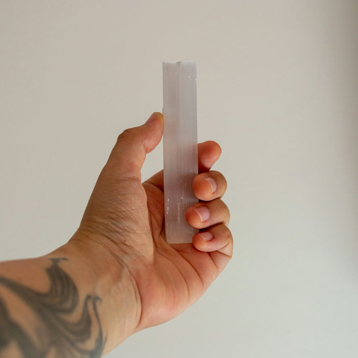 Hand holding a translucent rectangular object