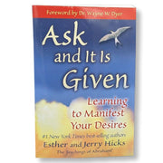 A book cover of 'Ask and It Is Given' by Esther and Jerry Hicks, featuring a title and author text, with a background of clouds and a bird in flight.