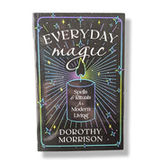 Book titled 'Everyday Magic' by Dorothy Morrison with a candle illustration on the cover.