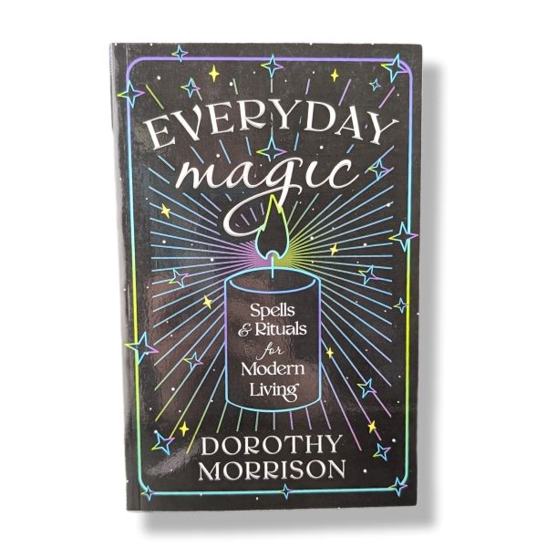 Book titled 'Everyday Magic' by Dorothy Morrison with a candle illustration on the cover.