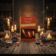 Book titled 'Candle Magic for Beginners' by Richard Webster on a wooden table with candles and crystals.