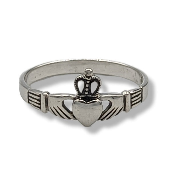 Silver Claddagh ring on a white background