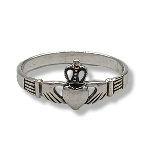Silver Claddagh ring on a white background