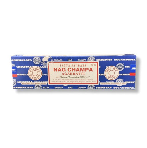 A rectangular box of Nag Champa Agarbatti incense sticks on a plain white background. The packaging is primarily blue with white and red text and circular seals, featuring the brand name 'Satta Sai Baba' and product name 'Nag Champa Agarbatti'.
