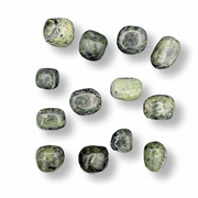 Set of green stones on a white background