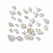 Collection of rough pink stones on a white background