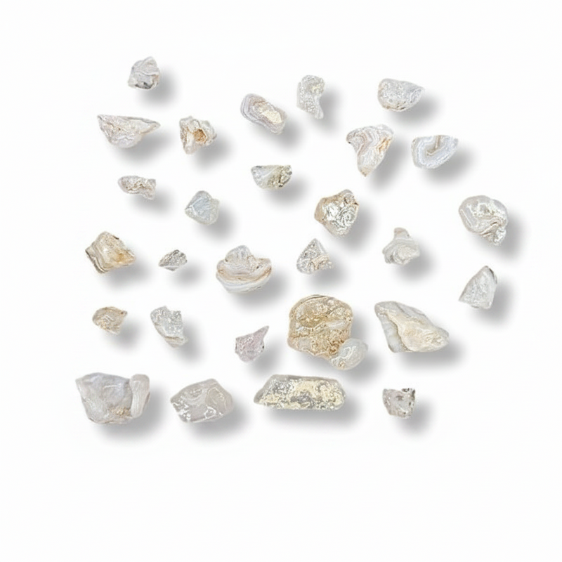 Collection of rough pink stones on a white background