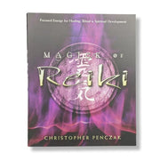 Book titled 'Magick of Reiki' by Christopher Penczak with a purple and gray design on the cover.