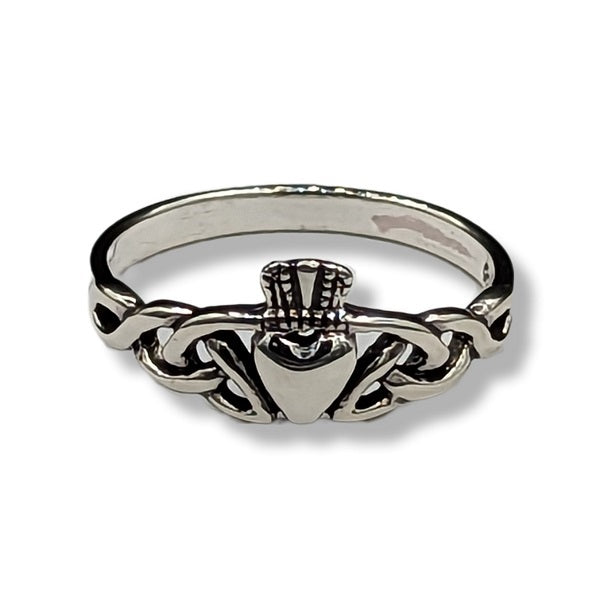 Silver claddagh ring on a white background