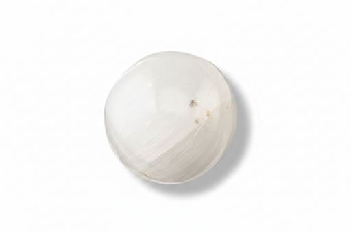 A selenite sphere on a white background