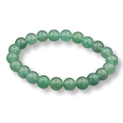 Green beaded bracelet on a white background