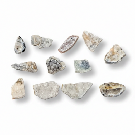 A set of agate pieces in various shapes and natural colors on a white background with soft drop shadows.