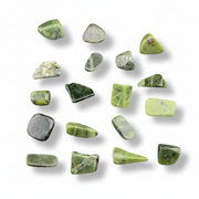 Collection of green stones on a white background