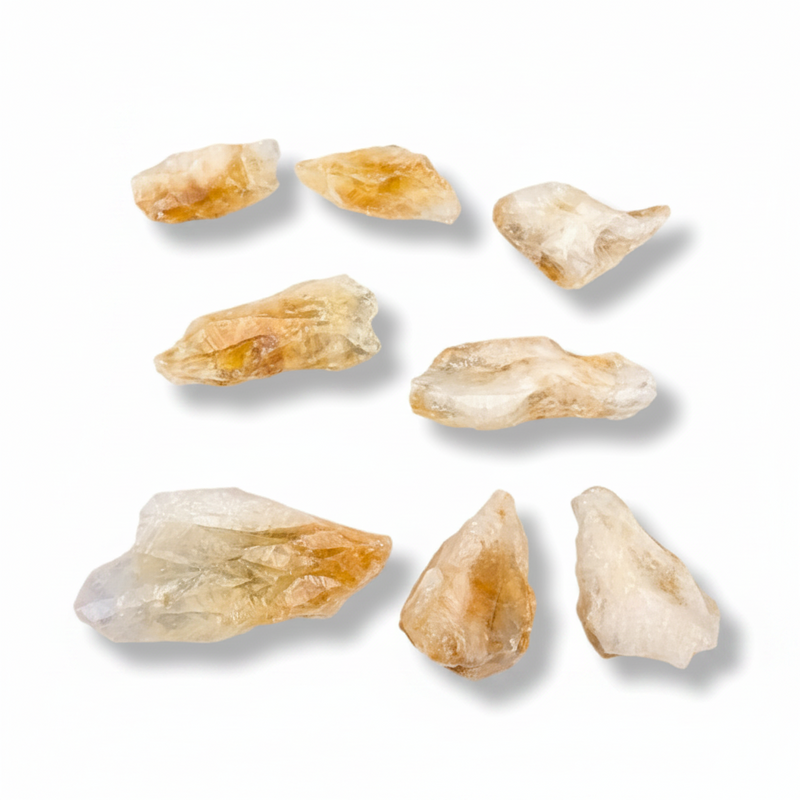 Raw citrine points on a white background