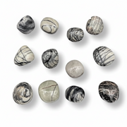 Set of marbled stone beads on a white background