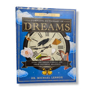 Book titled 'Llewellyn's Complete Dictionary of Dreams' with a blue cover featuring symbols and text.