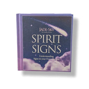 A hardcover book titled 'Spirit Signs' by Jade-Sky, featuring a dark blue night sky cover with a shooting star and clouds, set against a plain white background.