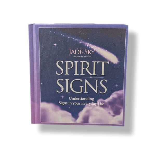 A hardcover book titled 'Spirit Signs' by Jade-Sky, featuring a dark blue night sky cover with a shooting star and clouds, set against a plain white background.