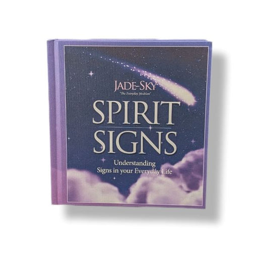 A hardcover book titled 'Spirit Signs' by Jade-Sky, featuring a dark blue night sky cover with a shooting star and clouds, set against a plain white background.