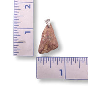 Pendant with a stone and sterling silver bail on a ruler for scale