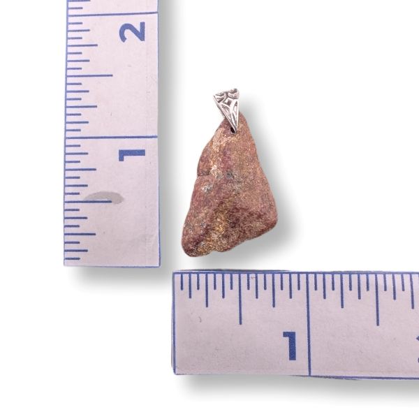 Pendant with a stone and sterling silver bail on a ruler for scale