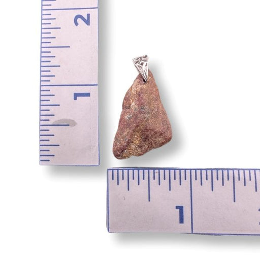 Pendant with a stone and sterling silver bail on a ruler for scale