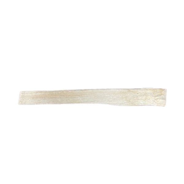 A single, thin, stick of palo santo  shown horizontally against a solid white background.