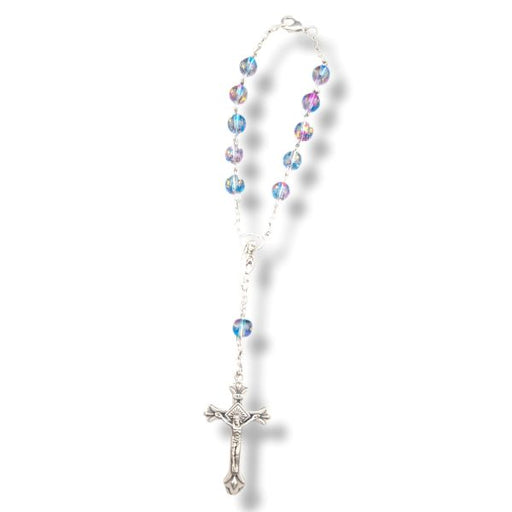 Rosary with multicolored beads and a silver cross on a white background