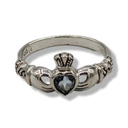 Silver claddagh ring with a heart-shaped stone on a white background