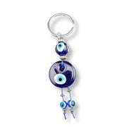 Keychain with blue evil eye beads on a white background