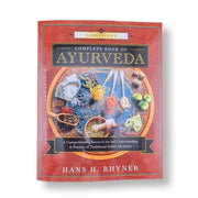 Ayurveda: Complete Book of Ayurveda by Hans H. Rhyner, featuring a red cover with a central circular illustration of traditional Indian medicine ingredients and utensils.