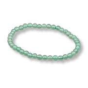 Green beaded bracelet on a white background