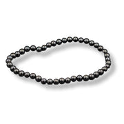 Black beaded bracelet on a white background