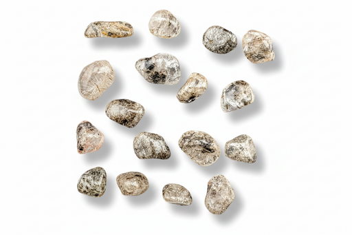 A group of  tumbled gemstones in clear, beige, and gray tones, arranged on a plain white background with soft drop shadows.