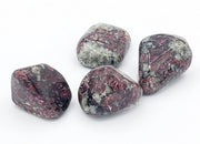 Four marbled rocks on a white background