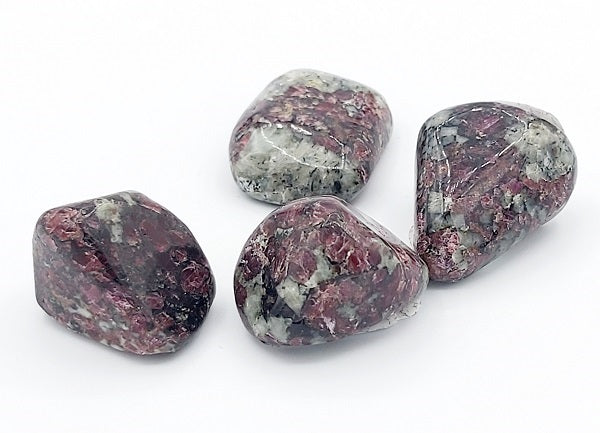 Four marbled rocks on a white background