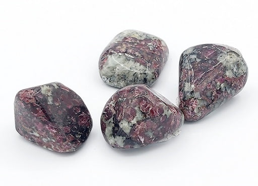 Four marbled rocks on a white background