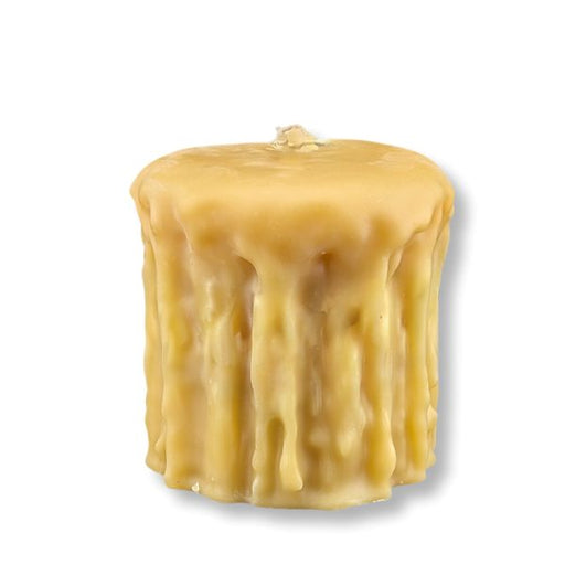 Beeswax candle with a textured surface on a white background