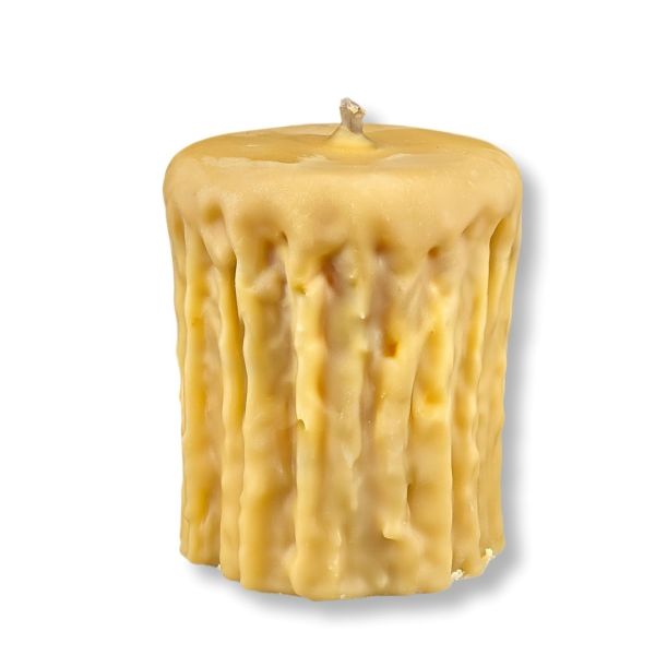 Textured yellow candle on a white background