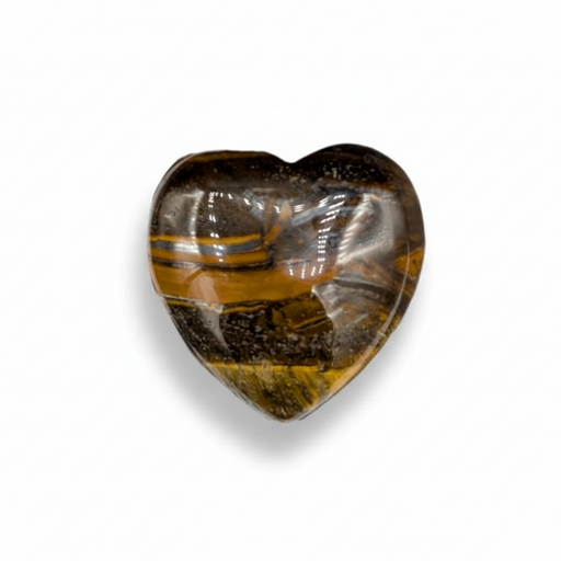 Heart-shaped tiger's eye stone next to a ruler on a white background