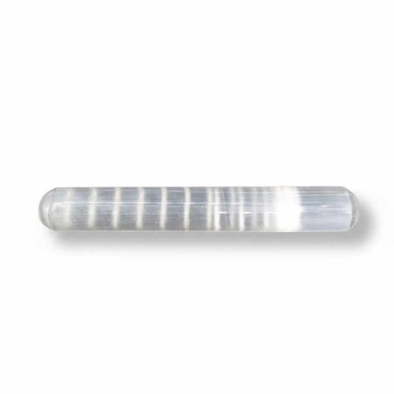 A cylindrical selenite with rounded ends, photographed on a white background with a soft shadow.