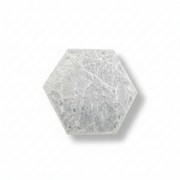 A hexagonal selenite plate, shown on a clean white background with a soft drop shadow.