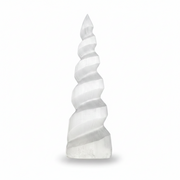 A tall, tapered spiral crystal tower made from selenite, featuring natural banding and striations, set against a solid white background with a soft shadow at the base.